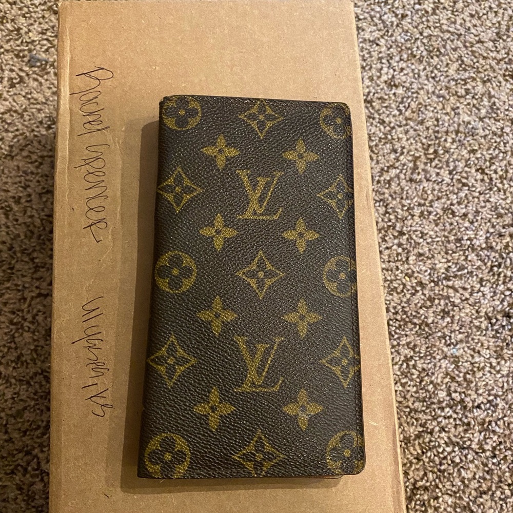 LV checkbook cover.